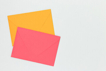Multicolored envelopes on a blue background. Minimal concept with copy space.