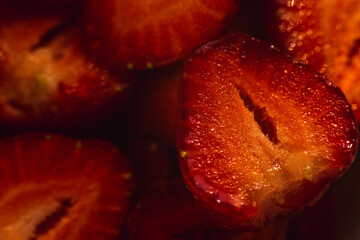 Red, ripe strawberries with well-defined texture in close-up. Macro shot of a strawberry....