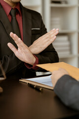 Businessman refusing money that comes with agreement paper, Anti bribery, and Anti Corruption...