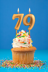 Birthday cake with candle number 79 - Blue background