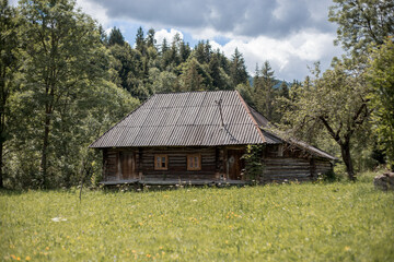 Old house in a village in the mountains. Ukrainian Carpathians