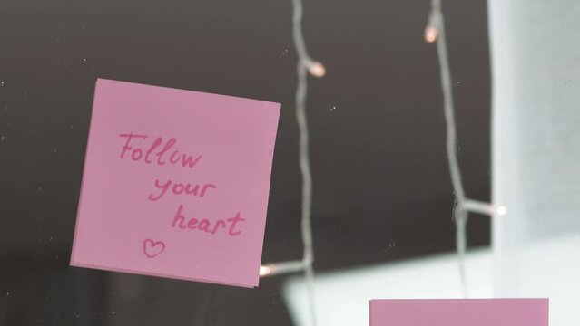inspirational quotes on pink sticker on the mirror,handwriting text.