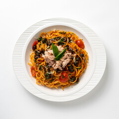Tuna pasta on white plate overhead view