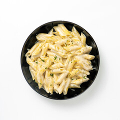 Homemade Italian four cheese pasta with parsley on white background