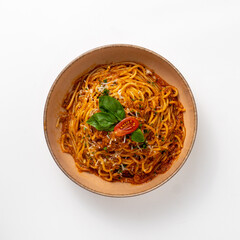 Bolognese pasta on white background top view