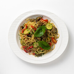 primavera pasta on white plate and white background