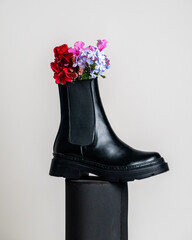 Black leather Chelsea boots with flowers