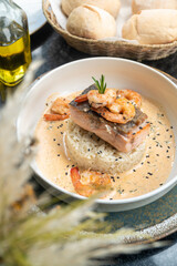 Delicious salmon and shrimp  with cream sauce served with rice