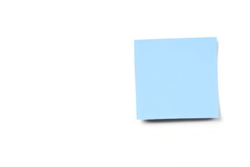 blue sticky note on a wall