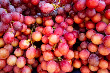 Red Grapes on Sale on a Sunny Day