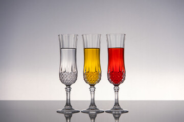 Champagne glass on shiny gray surface