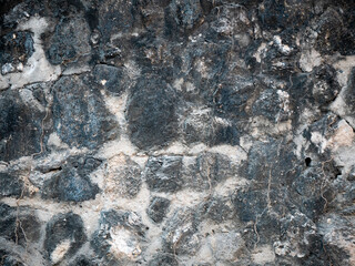 Aged and Cracked Black and White Stone Wall