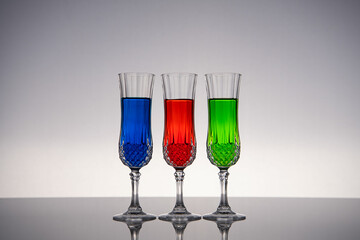 Champagne glass on shiny gray surface