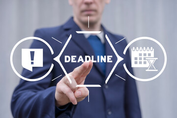 Businessman using virtual touch screen presses text: DEADLINE. Concept of deadline for time slipping away for important appointment date, schedule. Time management and business planning. - obrazy, fototapety, plakaty