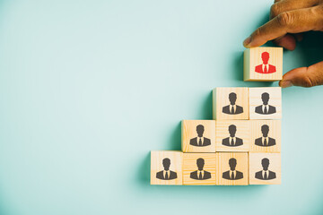 Captivating image showcasing human resources talent management and recruitment. Person icons on wooden cube block represent teamwork. Woman in leadership role emphasizes business success.