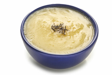 manioc broth (Creme de mandioca), cassava cream or cassava soup, typical Brazilian food, typically Brazilian cuisine, on white background with selective focus