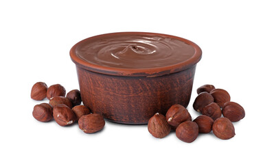 Bowl with delicious chocolate paste and hazelnuts on white background