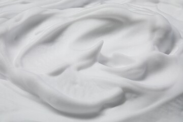 Obraz premium Texture of white shaving foam as background, closeup
