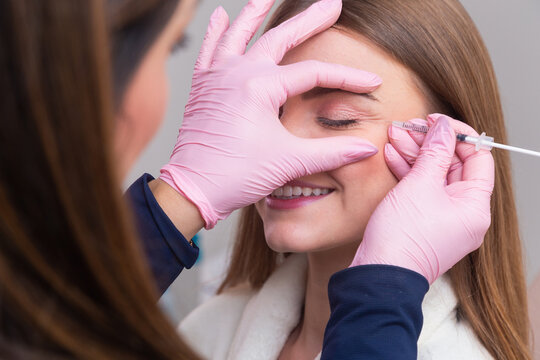 Woman wearing bathrobe in beauty clinic, aesthetics, patient, cosmetic procedures. botox application. anti wrinkle and anti aging.