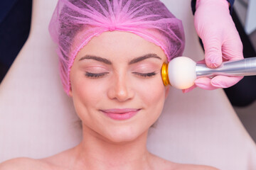 closeup photo of woman's face, photo of aesthetics, anti aging procedures. Radio frequency...