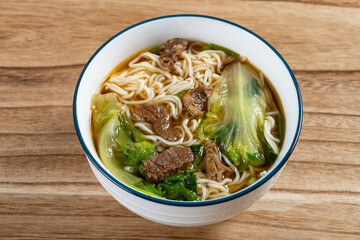angle view bowl of rice noodles with beef and cabbage horizontal composition
