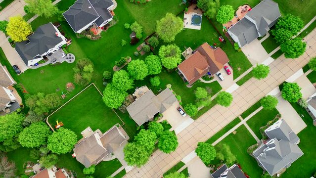 Beautiful neighborhoods, perfect homes in Springtime, aerial drone view.