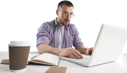 Man in glass for vision protection working remotely on netbook