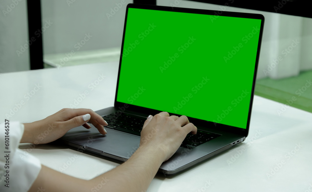 Poster green screen laptop computer for your copy space and text advertising. woman using notebook empty sc