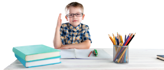Happy child writing in a notebook in the classroom