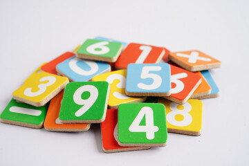 Number wood block cubes for learning Mathematic, education math concept.