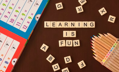 Learning is fun tiles with pencils and math book