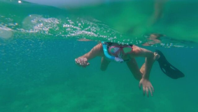 Girl Snorkeling Close To The Surface