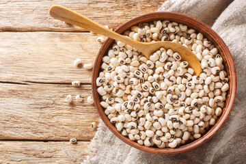 Black eye bean Vigna unguiculata closeup on the bowl. Horizontal top view from above