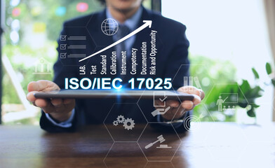 A man uses a tablet to access the quality assurance system of the ISO IEC 17025 standard for the management of testing and calibration laboratory.