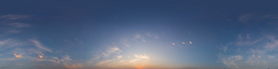 Sunset sky panorama with bright glowing pink Cirrus clouds. Seamless hdr 360 panorama in spherical...