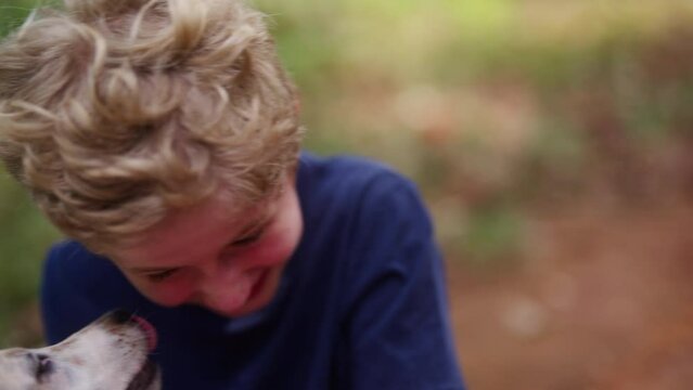 Boy With Dog Licking His Face