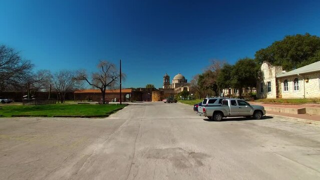 Aerial Shot Of Mission San Jose Church Against Blue Sky, Drone Ascending Forward Over City On Sunny Day - San Antonio, Texas