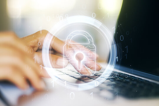 Creative idea concept with lock symbol and microcircuit illustration and hands typing on laptop on background. Protection and firewall concept. Multiexposure