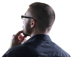 Handsome young thinking businessman in glasses