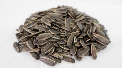 A lot of sunflower seeds on a white background
