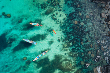 Island and boat in clear sea at Koh Tao