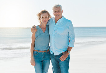 Mature, couple and beach with portrait on vacation hold for happiness or travel in summer. Senior, woman and man hug at the ocean on holiday in the outdoor with smile and sun for retirement.