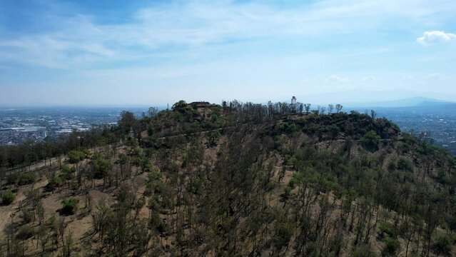 take off drone shot of east Mexico city over cerro de la estrella in iztapalapa in the morning