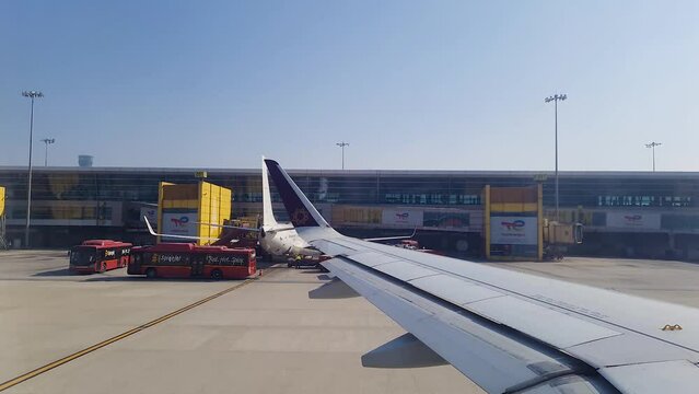 flight window view aircraft leaving terminal for take off at day video taken at vistara flight at indra gandhi international airport new delhi india on Mar 05 2022.