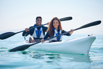 Kayak, rowing and couple on a boat at ocean, lake or river for water sports or fitness challenge....