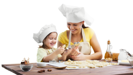The beautiful young mother and her little daughter cooking