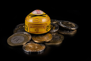 A symbolic Kazakh yurt, the traditional dwelling of nomads, on a pile of Kazakh coins in...