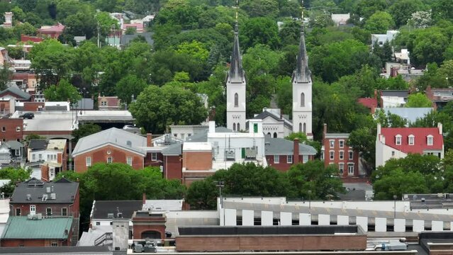 Urban American city downtown historic district. Long aerial zoom view in summer.
