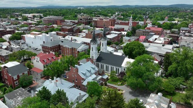 Rising aerial view of town and downtown city of Frederick County Maryland. Frederick MD.