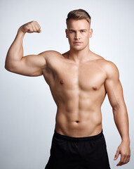 Portrait of man, bodybuilder and bicep flex in studio, background and exercise for muscular power....